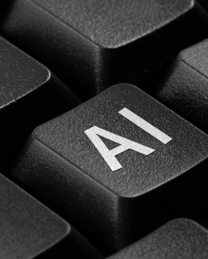 Tecla de teclado com a sigla IA, representando o impacto da inteligência artificial na comunicação e nas marcas.